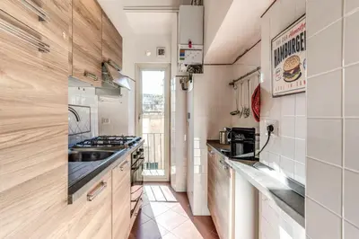 a kitchen with a sink and a stove top oven at AwesHomeItaly - Spagna Glamour Life Penthouse in Rome