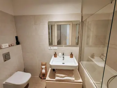 a bathroom with a sink and a toilet and a shower at Ancient Rome Studio in Rome