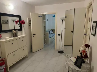 a room with a bathroom with a sink and a mirror at SweetHome Lisa in Rome