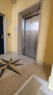 a lobby with a door with a star on the floor at Appartamento esclusivo Casalino Vatican Suite in Rome