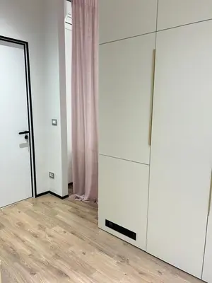 a room with white cabinets and a mirror at Luxury Nest Ponte Milvio in Rome