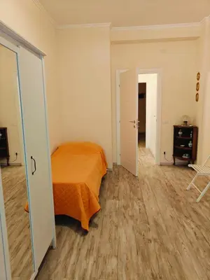 an empty room with a bed and a hallway at B&B A casa da Mami in Rome