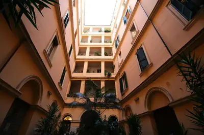 a hallway of a building with plants in it at Casa Vacanze Nonno Giulio in Rome