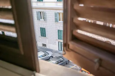 a view of a parking lot from a window at Domus Palestro in Rome