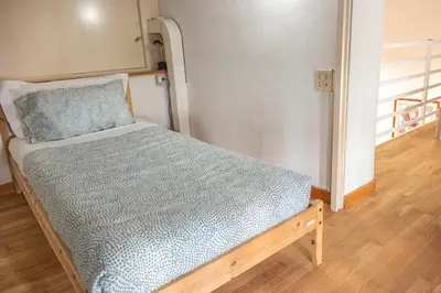 a small bed in a small room with at Domus Palestro in Rome