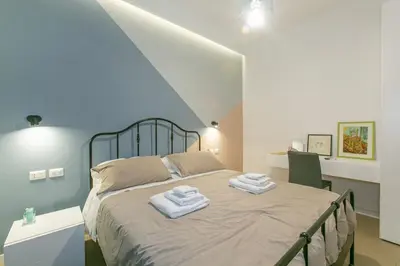 a bedroom with a bed with towels on it at Appia Comfort Zone in Rome