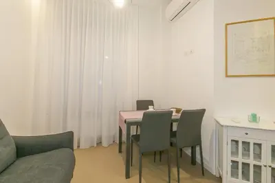 a dining room with a table and chairs at Appia Comfort Zone in Rome