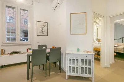 a room with a table and chairs and a bedroom at Appia Comfort Zone in Rome