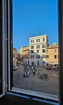 a view from a window of a city street at Mica Aurea Apartments Trastevere in Rome