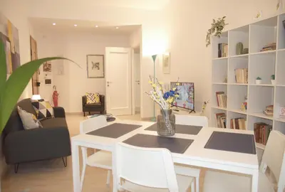 a living room with a white table and chairs at Vatican Malvi Domus in Rome
