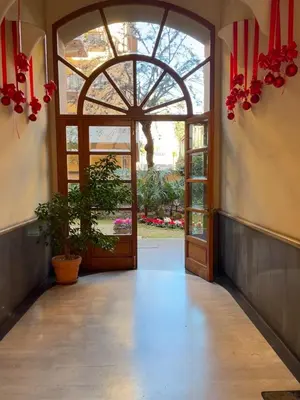 an entrance to a building with an open door at MNC House Roma in Rome