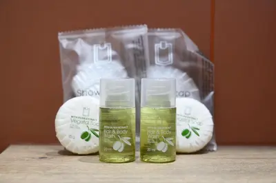 two bottles of green liquid in front of a bag at Da Eleonora - Centro di Roma in Rome