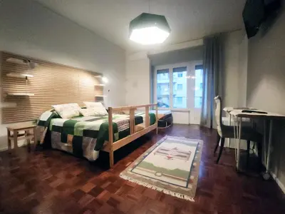 a bedroom with a bed and a desk and a window at BedEpoque - Camera 3 in Rome