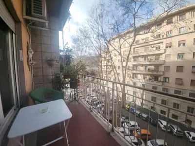 a balcony with a white table and a building at BedEpoque - Camera 3 in Rome