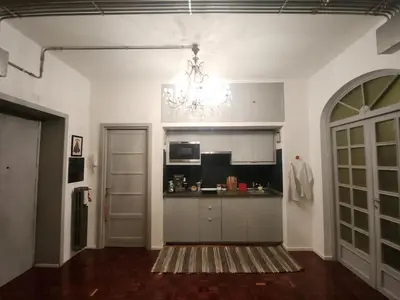 an empty kitchen with a chandelier in a room at BedEpoque - Camera 3 in Rome