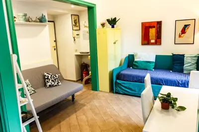a small room with a bed and a couch at Domus Vaticanae in Rome