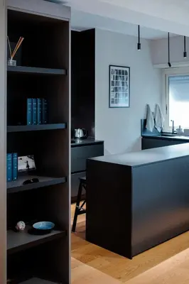 a kitchen with a black counter in a room at Roma Urban Retreat in Rome