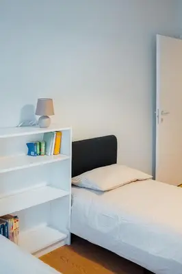 a bedroom with a bed and a book shelf at Roma Urban Retreat in Rome
