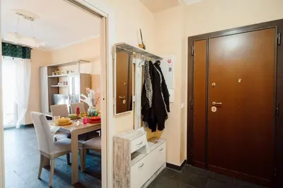 a dining room with a table and a mirror at Dream Vacation Suites in Rome