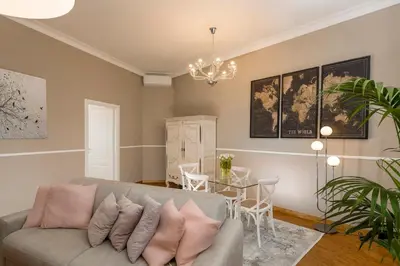 a living room with a couch and a table at Maisondesfleurs in Rome