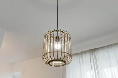 a cage chandelier hanging from a ceiling in a room at BMGA l Aurelian 3Bdr 6-Guest Gem in Rome