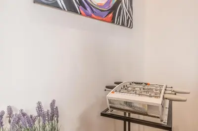 a wall mounted sewing machine next to a painting at Via Nizza 126 Luxury in Rome