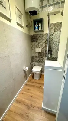 a small bathroom with a toilet and a shower at Matilda House San Paolo Roma in Rome