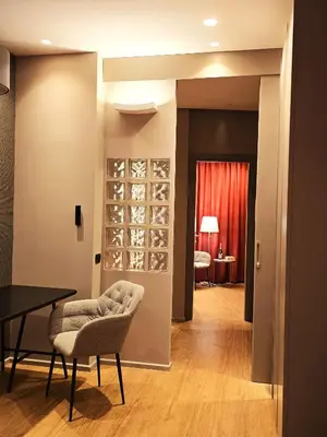 a dining room with a table and chairs and a wine cellar at Residenza Roma 19 in Rome