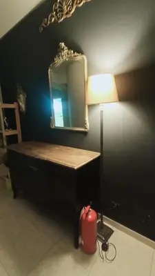 a room with a desk with a lamp and a mirror at apt via cernaia rome center in Rome
