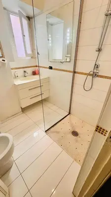 a bathroom with a shower and a toilet at apt via cernaia rome center in Rome