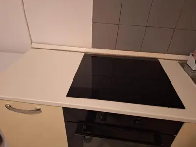 a white counter top with a microwave in a kitchen at apt treviso house in Rome
