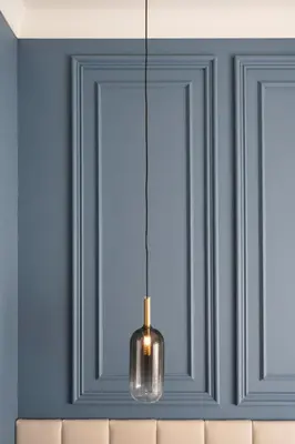 a pendant light hanging over a couch in a room at Eudora Guesthouse Roma in Rome