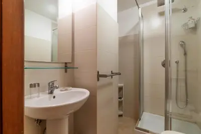 a bathroom with a sink and a shower at GuestHost - Charming Apartment near Piazza di Spagna in Rome