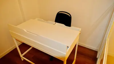 a white desk with a black chair on top of it at La Nuova Casa Di Zia - near metro A Ponte Lungo in Rome