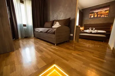 a living room with a couch and a bed at Love of Rome in Rome