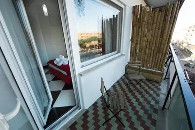 a room with a balcony with a view of a city at Love of Rome in Rome