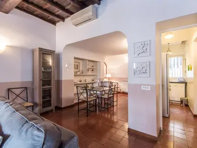 a living room with a couch and a table at Spacious 2BR in the historic center in Rome