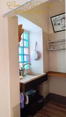 a kitchen with a sink and a window at Come' Na Vorta Apartment in Rome