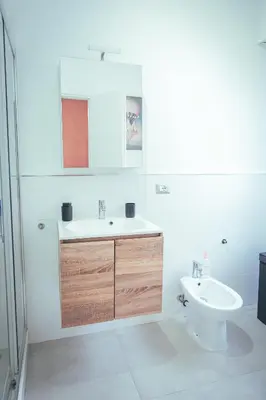 a bathroom with a sink and a toilet at Urban House Monteverde in Rome