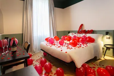 a room with a bed with balloons on it at Saint Suites in Rome