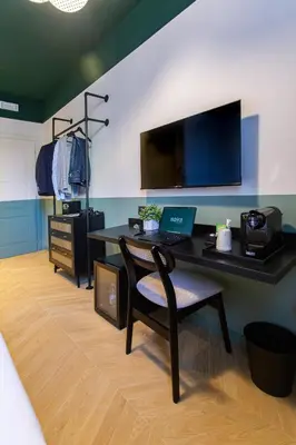 a room with a desk with a laptop on it at Saint Suites in Rome