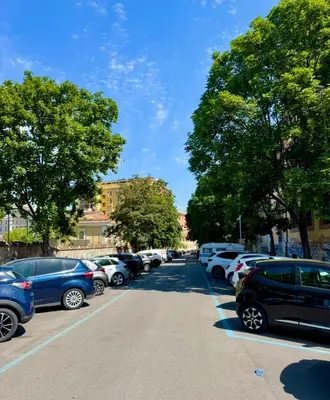 a row of cars parked in a parking lot at Vaschome in Rome
