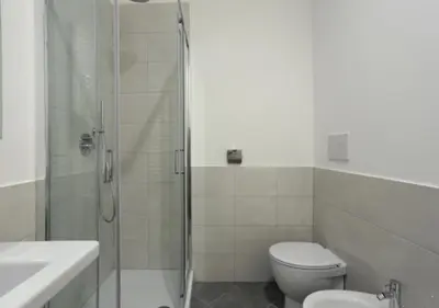 a bathroom with a shower and a toilet and a sink at Centro Roma Verde - LOCAPPART in Rome