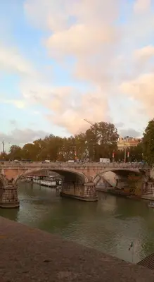 a bridge over a river in a city at RiversideMellini44 in Rome