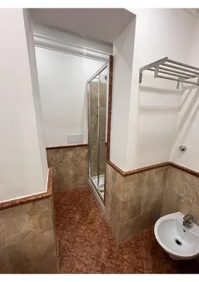 a bedroom with a bed and a table and a chair at Spqr Suite Guest House in Rome