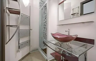 a bathroom with a glass sink and a mirror at Ungaretti Vatican Apartment in Rome
