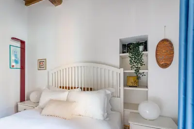 a bedroom with a white bed with white pillows at iFlat Classy & Spacious apt near Campo de Fiori in Rome