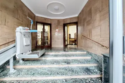 a room with a stone floor and stairs in a building at Casa Giannetta in Rome