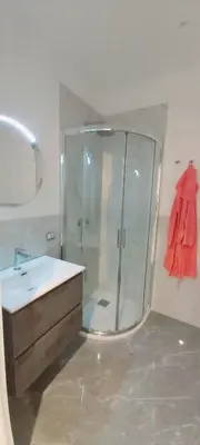 a bathroom with a shower and a sink at Dodo's luxury house in Santa Maria Maggiore in Rome