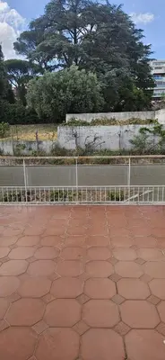 a tennis court with a fence in front at Anastasio Terrace double 3 in Rome